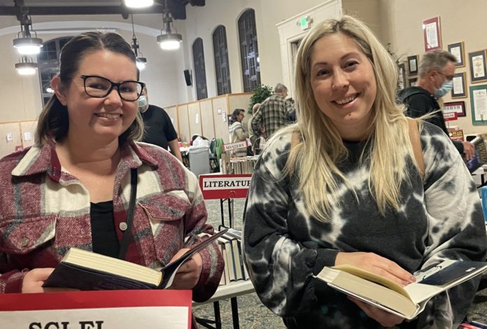 PHOTO: provided by FSPPL | The South Pasadenan | Roxanne Garcia (left) and Angela Watson love books and decided they had to attend the Friends of the Library Holiday Book Sale.