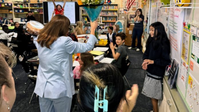 PHOTO: SPUSD | The South Pasadenan | Left: Superintendent Angela Elizondo Baxter surprises Arroyo Vista 4th Grade Teacher Jennifer Simon (back right corner) with the District Teacher of the Year honor.