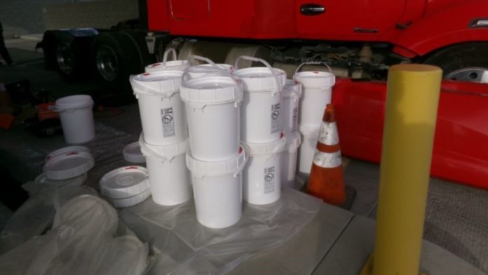 PHOTO: CBP | The South Pasadenan | U.S. Customs and Border Protection officers at the Otay Mesa Cargo Facility seized over 900 pounds of liquid methamphetamine concealed in the fuel tank of a tractor-trailer.