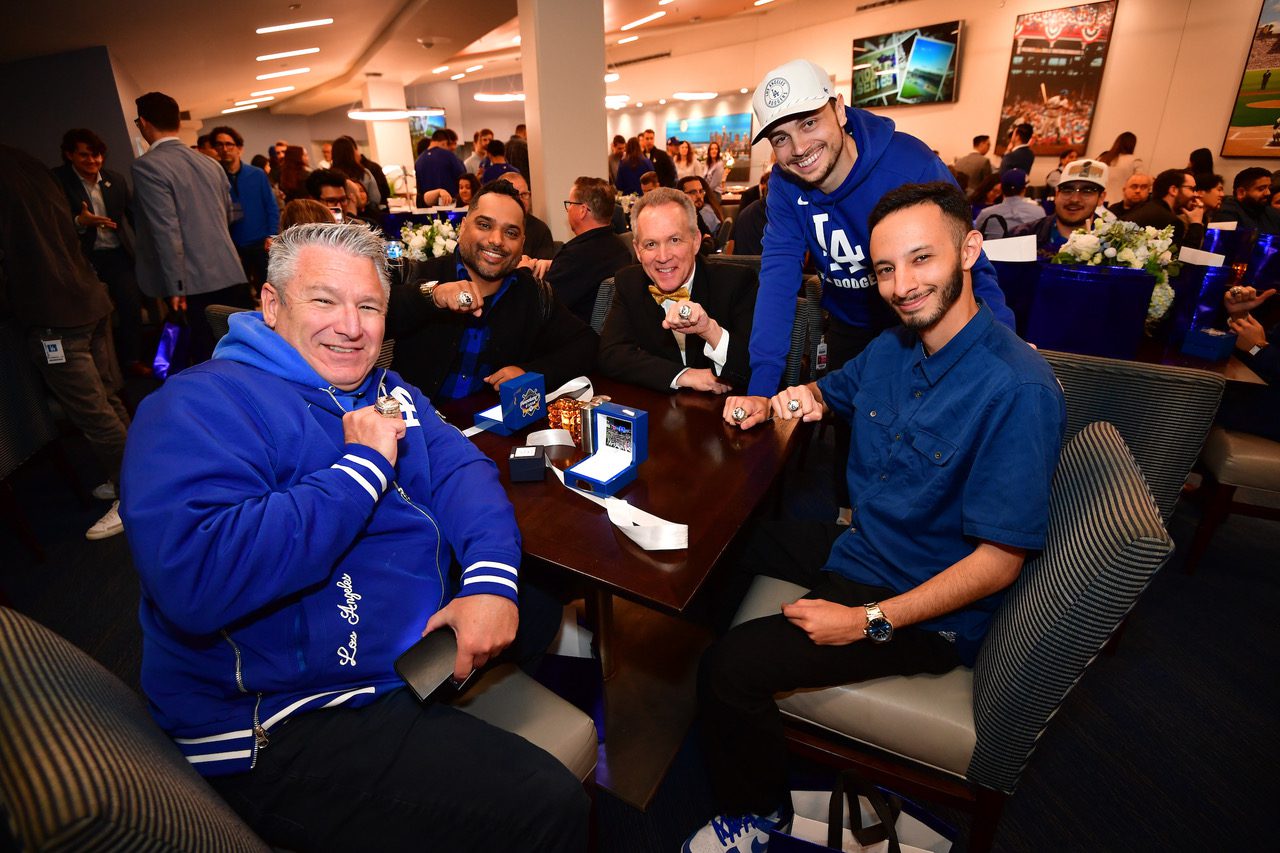 Mark Langill, third from left, is joined by other Dodger employees at the ring ceremony.