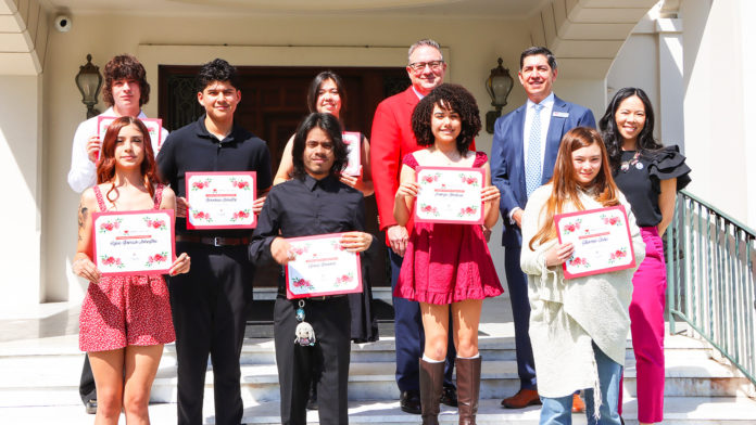 PHOTO: Pasadena Tournament of Roses | The South Pasadenan | Front Row (Left to Right): Kylie Garcia-Johnston, Rose City High School; Elexis Guerra, John Muir High School; Ellerose Chan, Thurgood Marshall Secondary School Second Row (Left to Right): Giovanni Benitez, Pasadena High School; Maryn Goodwin, Thurgood Marshall Secondary School; Dr. Helen Hill, Pasadena Unified School District Chief Academic Officer Back Row: (Left to Right): Louden Rangel, Blair High School; Sienna Wei Bonoli, John Muir High School; Terry Madigan, Pasadena Tournament of Roses Association President; Daniel Limon, EVP, Banking Division Manager for Citizens Business Bank (Not Pictured: Brianna Miguel, John Muir High School)