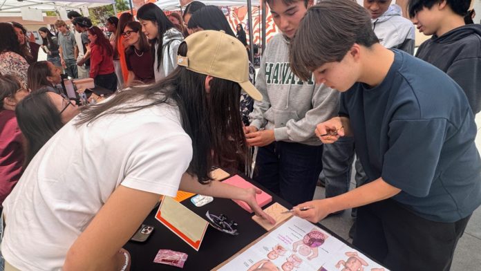 PHOTO: SPUSD | The South Pasadenan | Pediatric general surgeon Dr. Roxanne Massoumi gives students a brief lesson in suturing at the 2026 SPHS Career Fair.