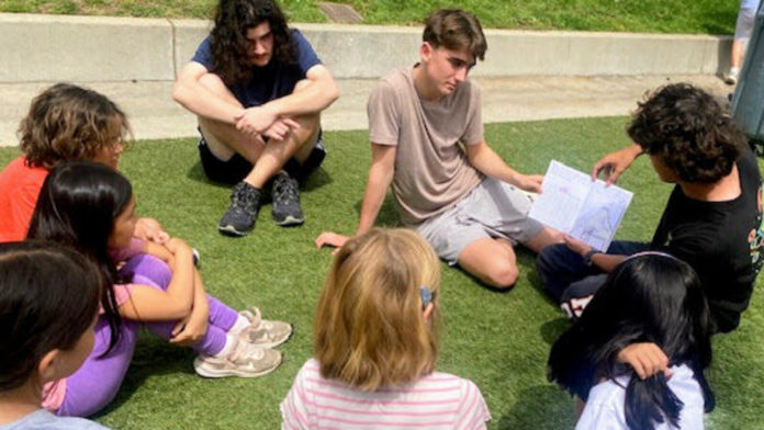 PHOTO: Katie Jaroch | The South Pasadenan | SPHS 10th graders read fictional stories to Marengo second graders.
