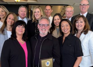 Bill Buckley (center) and South Pasadena Unified School District representatives celebrated Buckley receiving the Golden Apple Award for Volunteerism. (Photo Courtesy of South Pasadena Unified School District)