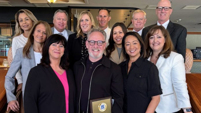 Bill Buckley (center) and South Pasadena Unified School District representatives celebrated Buckley receiving the Golden Apple Award for Volunteerism. (Photo Courtesy of South Pasadena Unified School District)