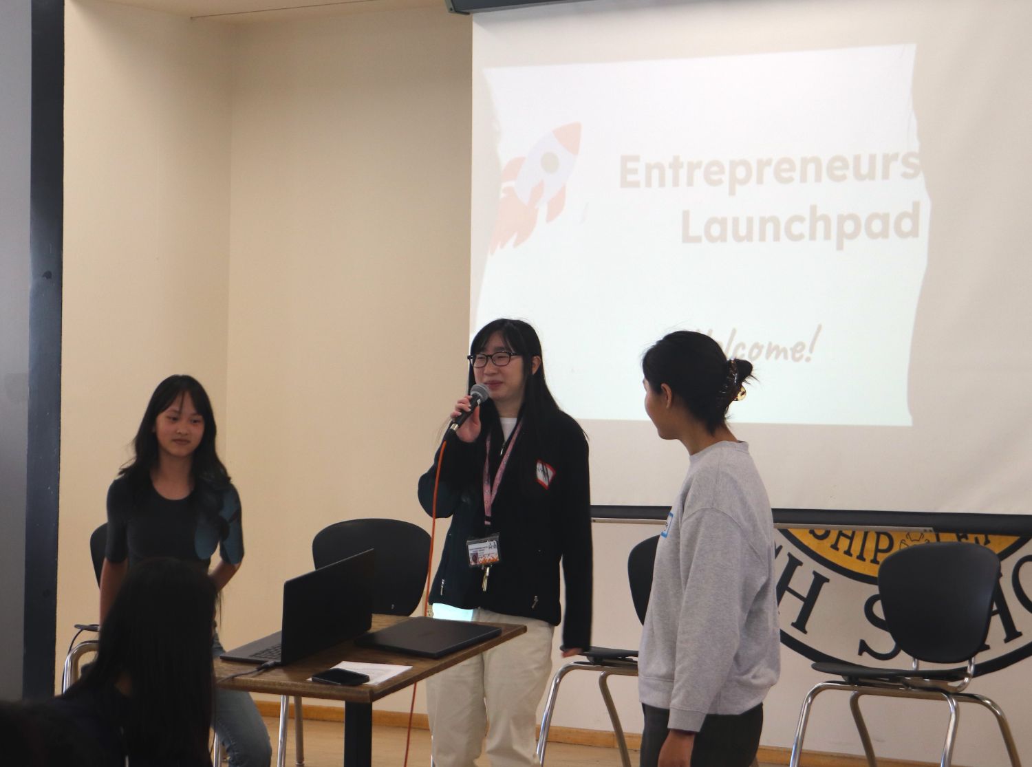 PHOTO: Brett Chang | The South Pasadenan | SPHS | Eileen Chen and Pierrette Chen pitch their idea as Audrey Zheng moderates