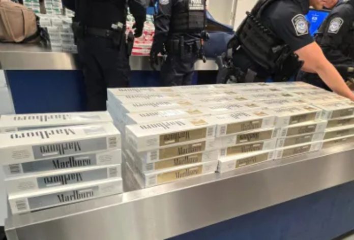 PHOTO: CBP | The South Pasadenan | CBP officers inspecting 749 cartons of contraband cigarettes at Long Beach Cruise Ship Terminal
