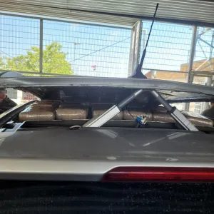 PHOTO: CBP San Diego | The South Pasadenan | By way of thorough examination, U.S. Border Patrol agents discover an aftermarket motorized roof compartment containing 104 pounds of cocaine