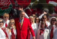 National Red Rose Day: White-Suited Volunteers Surprised People with Longstemmed Red Roses PHOTO: Pasadena Tournament of Roses Instagram | The South Pasadenan | National Red Rose Day Celebration
