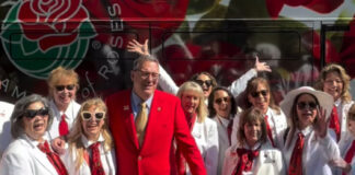 National Red Rose Day: White-Suited Volunteers Surprised People with Longstemmed Red Roses PHOTO: Pasadena Tournament of Roses Instagram | The South Pasadenan | National Red Rose Day Celebration