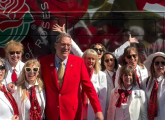 National Red Rose Day: White-Suited Volunteers Surprised People with Longstemmed Red Roses PHOTO: Pasadena Tournament of Roses Instagram | The South Pasadenan | National Red Rose Day Celebration