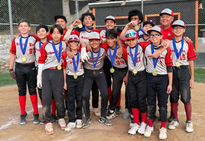PHOTO: Little League Baseball | The South Pasadenan | The Junior champions of the South Pasadena Little League celebrate their win with a team photo, proudly wearing their medals.