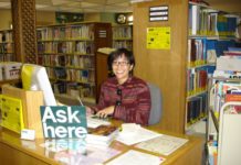 Photo Courtesy of South Pasadena Public Library | The South Pasadenan | Public Services Manager Maida Wong sits behind the reference desk at South Pasadena Library. Wong is retiring after working at the library over the past 37 years.