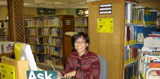 Photo Courtesy of South Pasadena Public Library | The South Pasadenan | Public Services Manager Maida Wong sits behind the reference desk at South Pasadena Library. Wong is retiring after working at the library over the past 37 years.