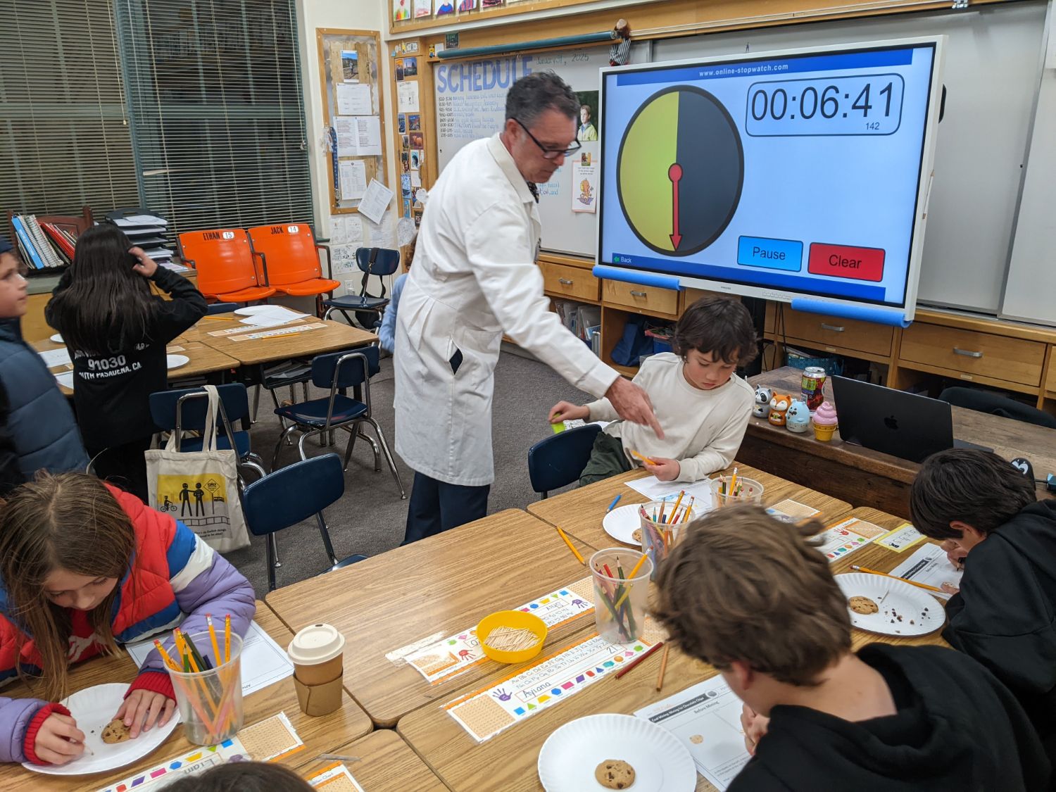 | The South Pasadenan | South Pasadena News Arroyo Vista Elementary South Pasadena AV STEM Night 2025: Teacher Brian Jehue helps student Otto K "mine" chocolate out of a cookie.