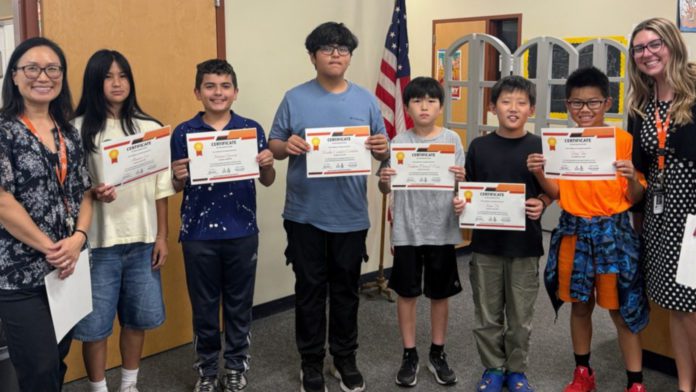 From left to right: Julie Ryu (Beginning ELD Teacher), Amara Lee, Matias Garcia, Nicolas Condori Cordoba, Yudam Daniel Lee, Eason Jin, Tony Tao, and Jessica Kammer (Intermediate ELD Teacher) celebrate students’ English language proficiency. (Photo Courtesy of South Pasadena Middle School) | The South Pasadenan