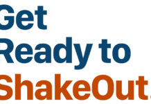Sign with the words 'Get Ready to ShakeOut' in blue and orange on a white background.