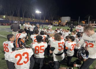 PHOTO: Anthony Chan | SPHS Tigers Football | coach Jeff Chi talking to his team after 35-21 CIF quarterfinal victory over St. Margaret’s Friday night.