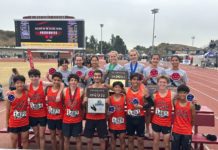 SPHS SPORTS RECORD | 3-Teams Bring Home a Collection of CIF Victories: Cross Country, Volleyball & Water Polo PHOTO: SPUSD | Tigers coach Mike Parkinson holds plaques awarded to the SPHS boys’ and girls’ cross country teams following the CIF Finals on Saturday in Walnut. South Pasadena High excelled mightily in three sports last Saturday, bringing home a collection of CIF-Southern Section plaques in three sport competitions – cross country, volleyball and water polo.