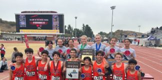 PHOTO: SPUSD | Tigers coach Mike Parkinson holds plaques awarded to the SPHS boys’ and girls’ cross country teams following the CIF Finals on Saturday in Walnut. South Pasadena High excelled mightily in three sports last Saturday, bringing home a collection of CIF-Southern Section plaques in three sport competitions – cross country, volleyball and water polo.
