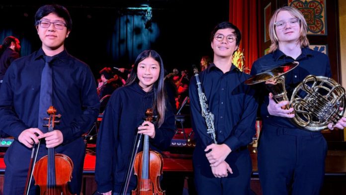 PHOTO: SPUSD | The South Pasadenan | Pictured left to right: Aiden Lee, Abigail Keum, Justin Kim, and Wilson Jaroch prepare for their performances during the Winter Choir Concert.