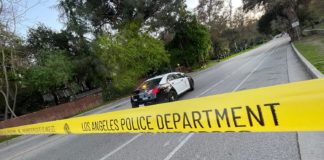 PHOTO: The South Pasadenan News | LAPD crime scene tape blocks off Marmion Way from the South Pasadena side to the 110 Freeway entrance/exit as officers investigate a shooting that occurred Saturday night.