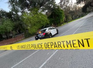 PHOTO: The South Pasadenan News | LAPD crime scene tape blocks off Marmion Way from the South Pasadena side to the 110 Freeway entrance/exit as officers investigate a shooting that occurred Saturday night.