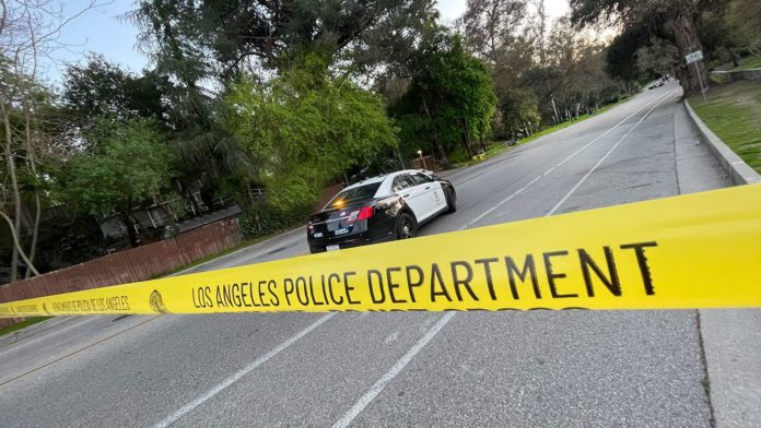 PHOTO: The South Pasadenan News | LAPD crime scene tape blocks off Marmion Way from the South Pasadena side to the 110 Freeway entrance/exit as officers investigate a shooting that occurred Saturday night.
