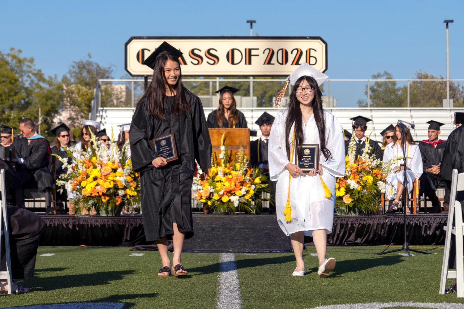 PHOTO: South Pasadena News | Mac Shropshire | SPHS Graduation 2026: The 2026 SPHS valedictorian, Alexa Chang, and salutatorian, Eileen Chen, accept their awards.