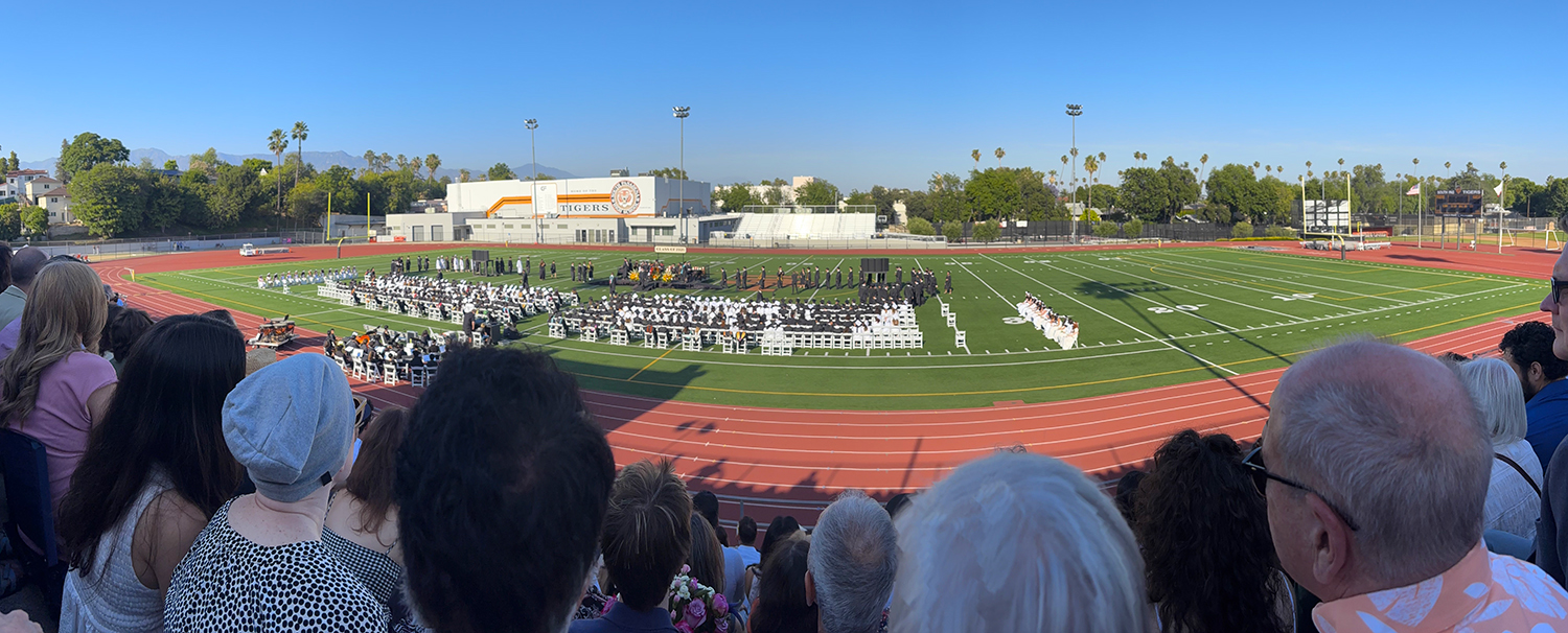 South Pasadena high school graduation class of 2026. Overview from the stands at the football stadium. SPHS Tigers walk the field.