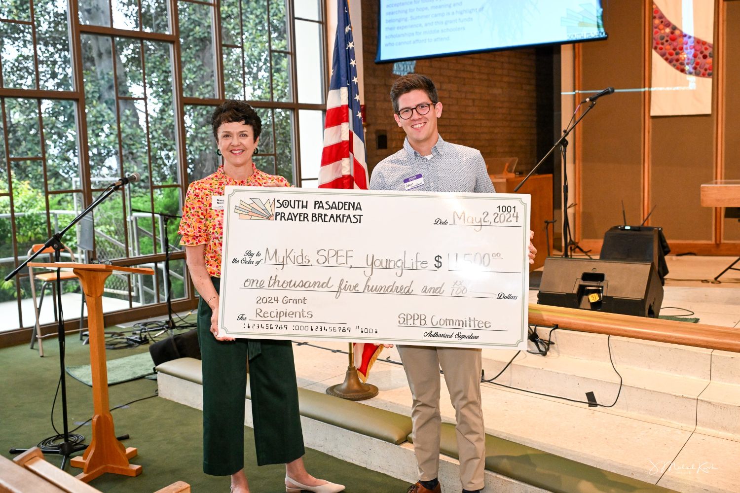 PHOTO: provided by Karen Kano | The South Pasadenan | SPPB Chair Nancy Norris presents 00 grant to Adam Sonneland of YoungLife South Pasadena / San Marino