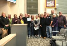 PHOTO: Samantha Shiroishi | The South Pasadenan | South Pasadena Tournament of Roses Committee and volunteers gather for a photo inside the South Pasadena City Council Chambers following the high recognition from the city.