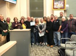 PHOTO: Samantha Shiroishi | The South Pasadenan | South Pasadena Tournament of Roses Committee and volunteers gather for a photo inside the South Pasadena City Council Chambers following the high recognition from the city.
