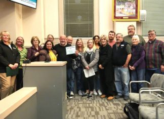 PHOTO: Samantha Shiroishi | The South Pasadenan | South Pasadena Tournament of Roses Committee and volunteers gather for a photo inside the South Pasadena City Council Chambers following the high recognition from the city.