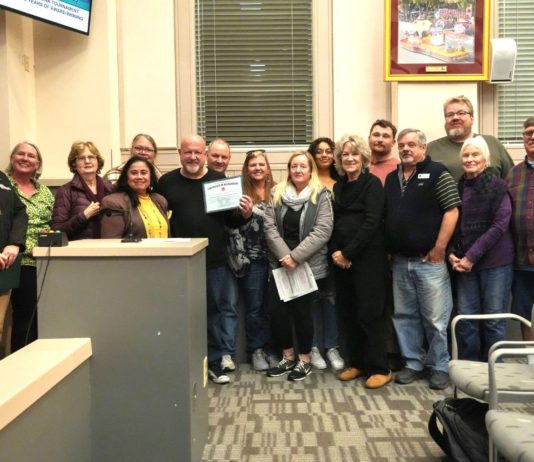 PHOTO: Samantha Shiroishi | The South Pasadenan | South Pasadena Tournament of Roses Committee and volunteers gather for a photo inside the South Pasadena City Council Chambers following the high recognition from the city.