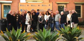 PHOTO: Samantha Shiroishi | The South Pasadenan | Members of the Sylvers group gathered with volunteers who built and decorated South Pasadena’s float outside the South Pasadena City Council chambers.