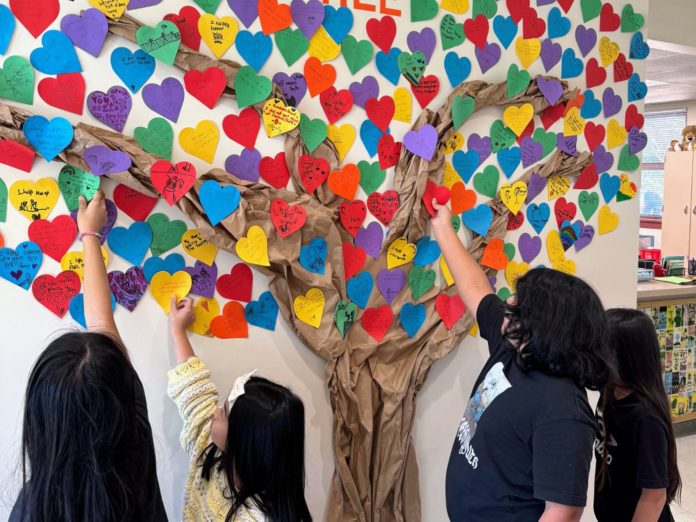 PHOTO: provided by Marengo Elementary School | The South Pasadenan | Marengo Elementary students add their acts of kindness to the school’s kindness tree in the main office.