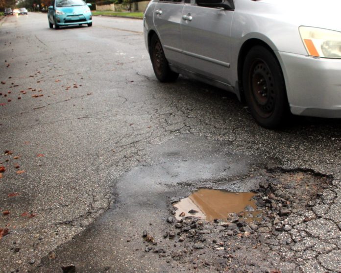PHOTO: Henk Friezer | The South Pasadenan | A pothole on Monterey and Marengo in South Pasadena.