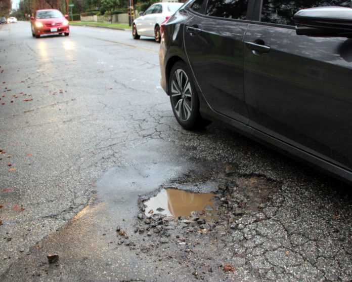 PHOTO: Henk Friezer | The South Pasadenan | A pothole on Monterey and Marengo in South Pasadena.
