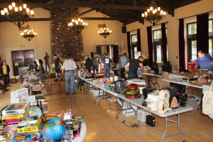 PHOTO: Henk Friezer | The South Pasadenan | Shoppers peruse the treasures at SPTOR's giant yard sale in 2023.