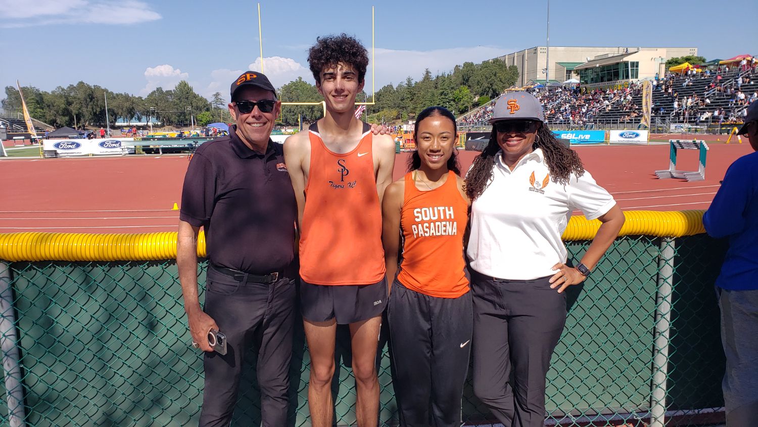 PHOTO: Mike Parkinson | The South Pasadenan | SPHS runners Keeran Murray and Mia Holden with coaches at CIF-SS Finals 2023.