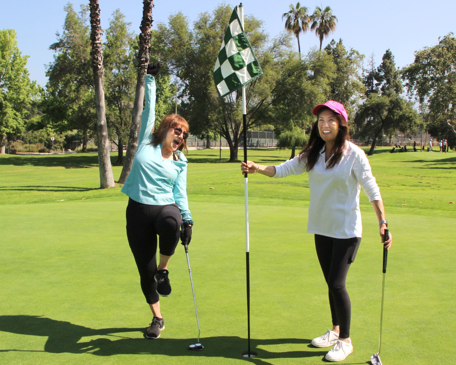 | The South Pasadenan | South Pasadena News PHOTO: Henk Friezer | The South Pasadenan | Mary Genovia (L) and Sharon Oda celebrate at a hole at the golf tournament. They represent the Woman’s Club of South Pasadena and Alhambra High School alumni.