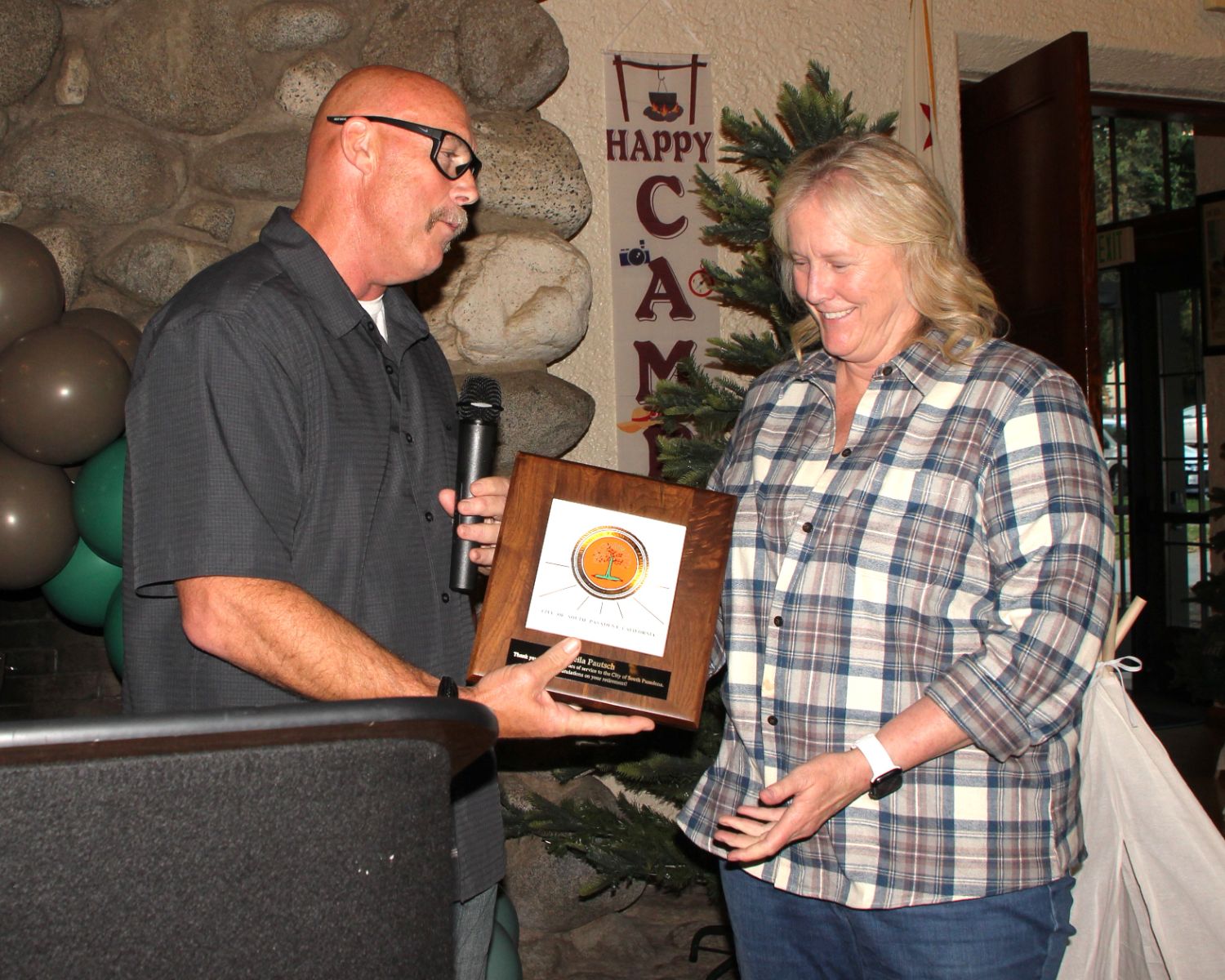PHOTO: Henk Friezer | The South Pasadenan | South Pasadena Community Services Director, Sheila Pautsch, receives a plaque from Fire Chief Paul Riddle at her retirement party.