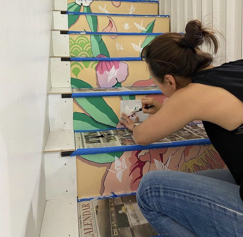 PHOTO: Quincy Sakai | The South Pasadenan | A community member adding cranes to the Cranes for a Change mural at Maya Salon.