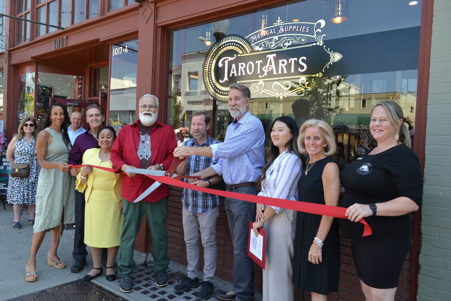 south-pasadena-news-07-15-2023-tarot-arts-ribbon-cutting-05 | The South Pasadenan | South Pasadena News PHOTO: Alisa Hayashida | The South Pasadenan | Tarot Arts celebrates its grand opening with a ribbon cutting. Pictured l-r: Chamber Board Member Karla Thompson, City Councilmember Evelyn Zniemer, City Councilmember Michael Cacciotti, Tarot Arts owner Willaim Toro, Mayor Jon Primuth, Tarot Arts owner Phillip Gibson, Erica Nam from Anthony Portantino's office, City Councilmember Janet Braun, and Chamber Ambassador Chantal Garcia.
