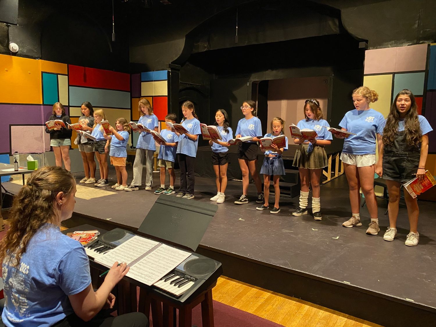 PHOTO: Alisa Hayashida | The South Pasadenan | SummertTheatre campers on stage at Fremont Centre Theatre pictured with director, Miranda Miller.