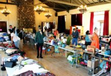 PHOTO: Henk Friezer | The South Pasadenan | Community members shop at a prior South Pasadena Tournament of Roses Yard Sale in the War Memorial Building.