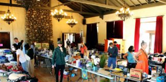 PHOTO: Henk Friezer | The South Pasadenan | Community members shop at a prior South Pasadena Tournament of Roses Yard Sale in the War Memorial Building.