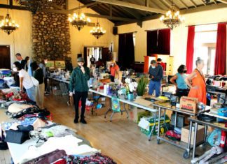 PHOTO: Henk Friezer | The South Pasadenan | Community members shop at a prior South Pasadena Tournament of Roses Yard Sale in the War Memorial Building.