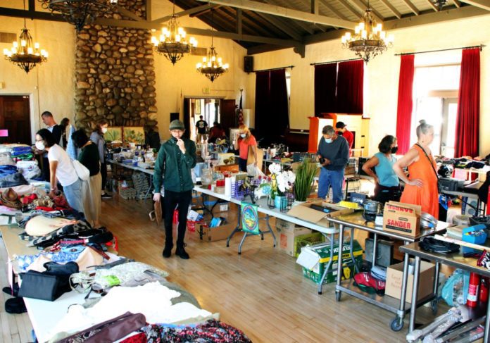 PHOTO: Henk Friezer | The South Pasadenan | Community members shop at a prior South Pasadena Tournament of Roses Yard Sale in the War Memorial Building.